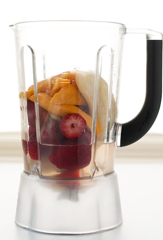 Coconut Water Smoothie with Mango, Banana, & Strawberries